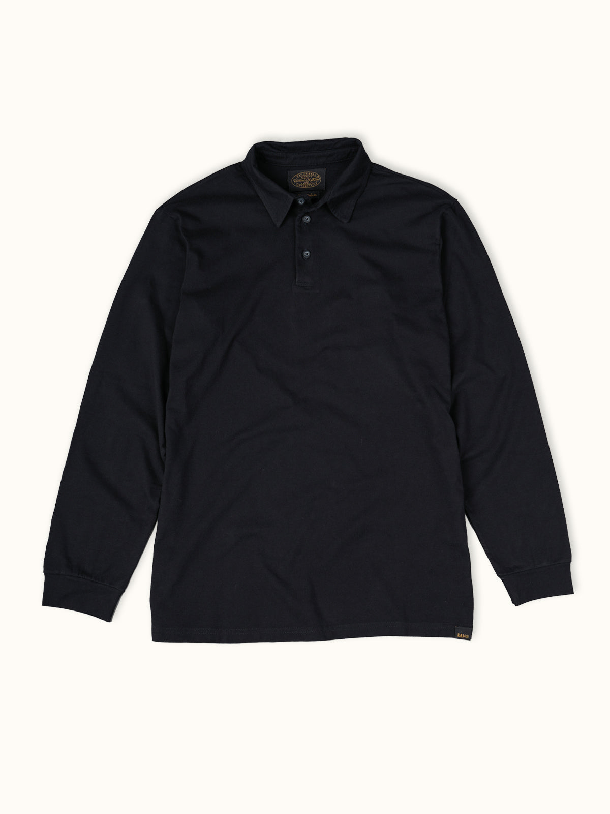 Playera Polo Manga Larga en Negro, vista frontal — jersey suave 100% algodón. Demons & Machines. #color_negro