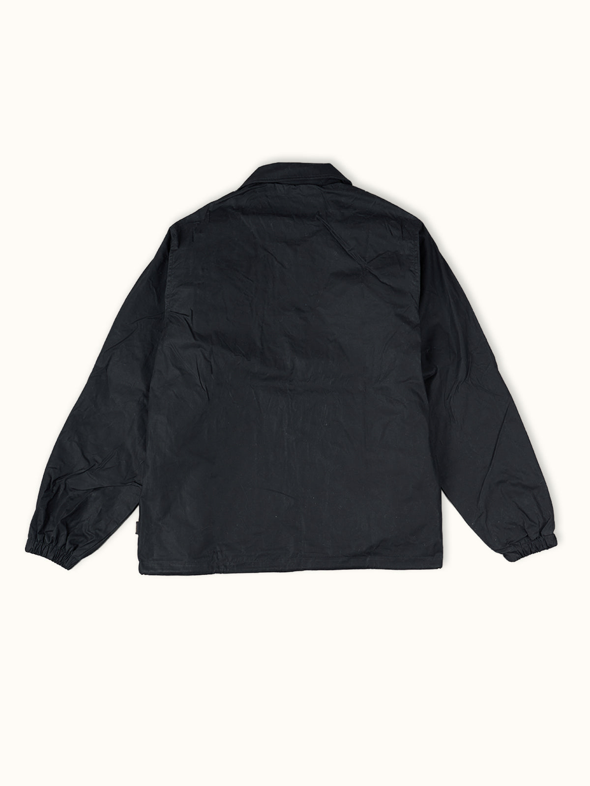 Rompevientos Nashville Wax Coach en Negro, vista trasera — el corte recto y el ruedo con cordón. #color_negro