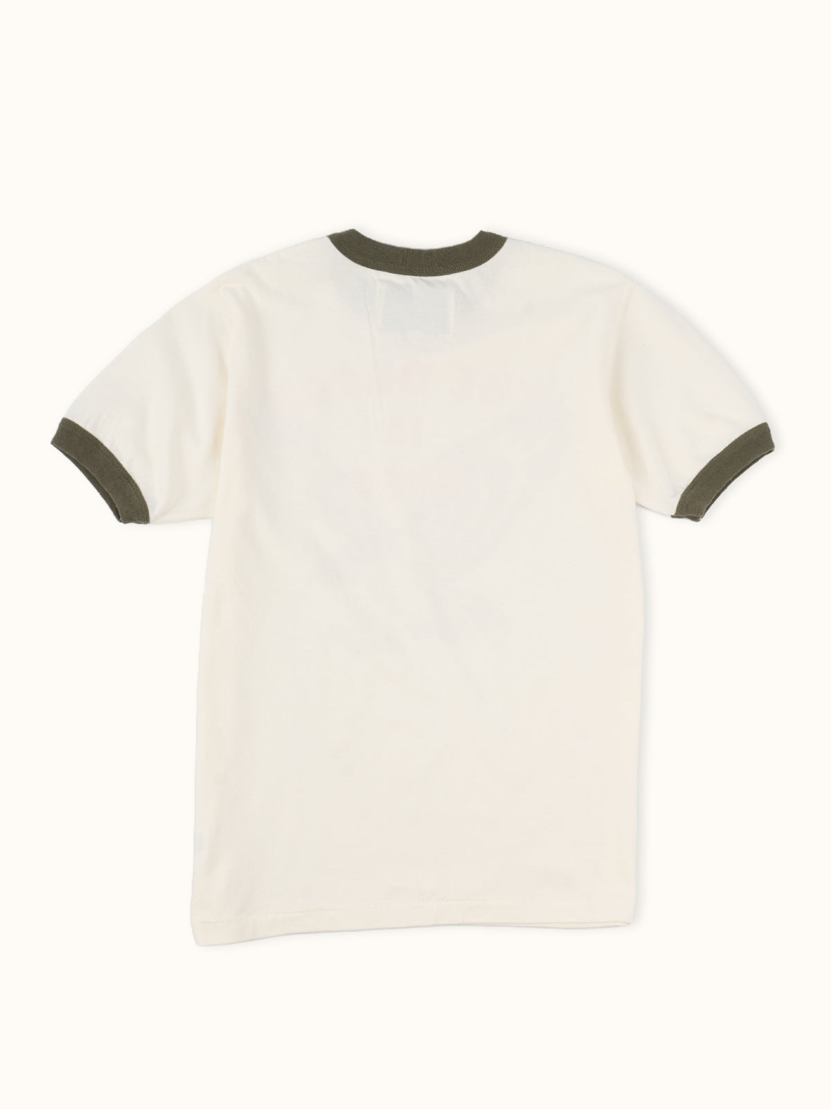Playera Sporty Mayer en Marfil, vista trasera — el estampado desgastado en la espalda. #color_marfil